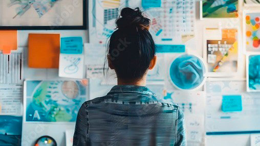 Lady looking at wall of stuff